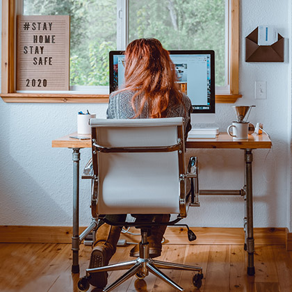 Girl sitting at home office desk